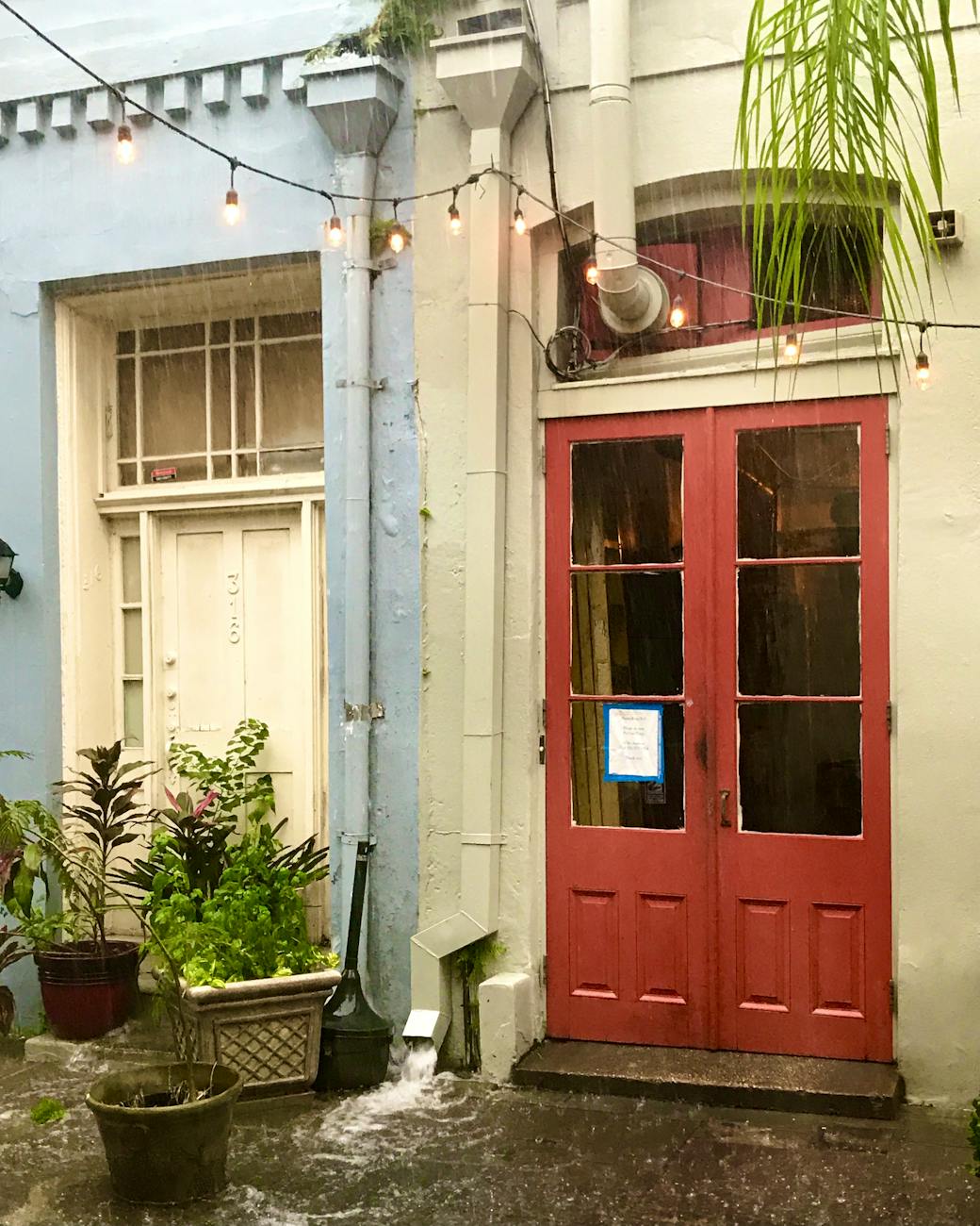 photo of a red door near a white door